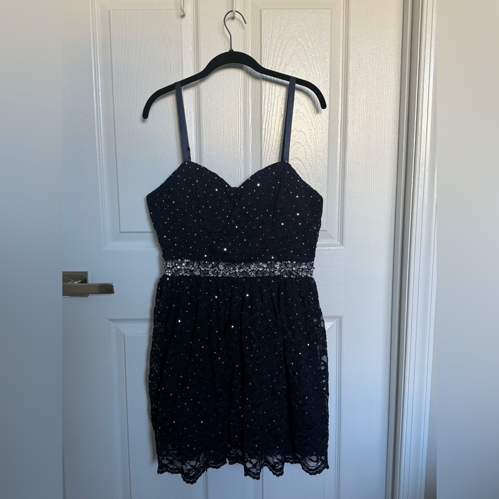 B. Smart Navy Blue Mini Dress with Silver Accents